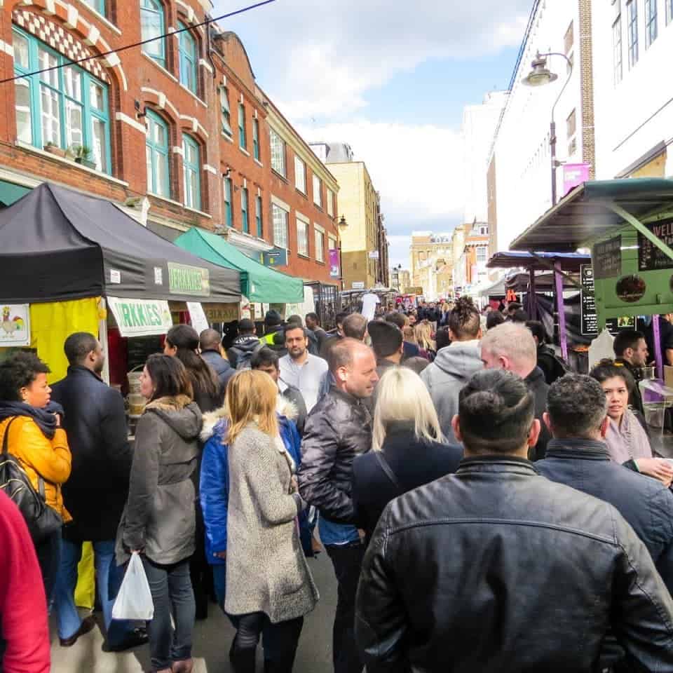 Street-food traders serving the lunchtime crowd at Leather Lane Market in London
